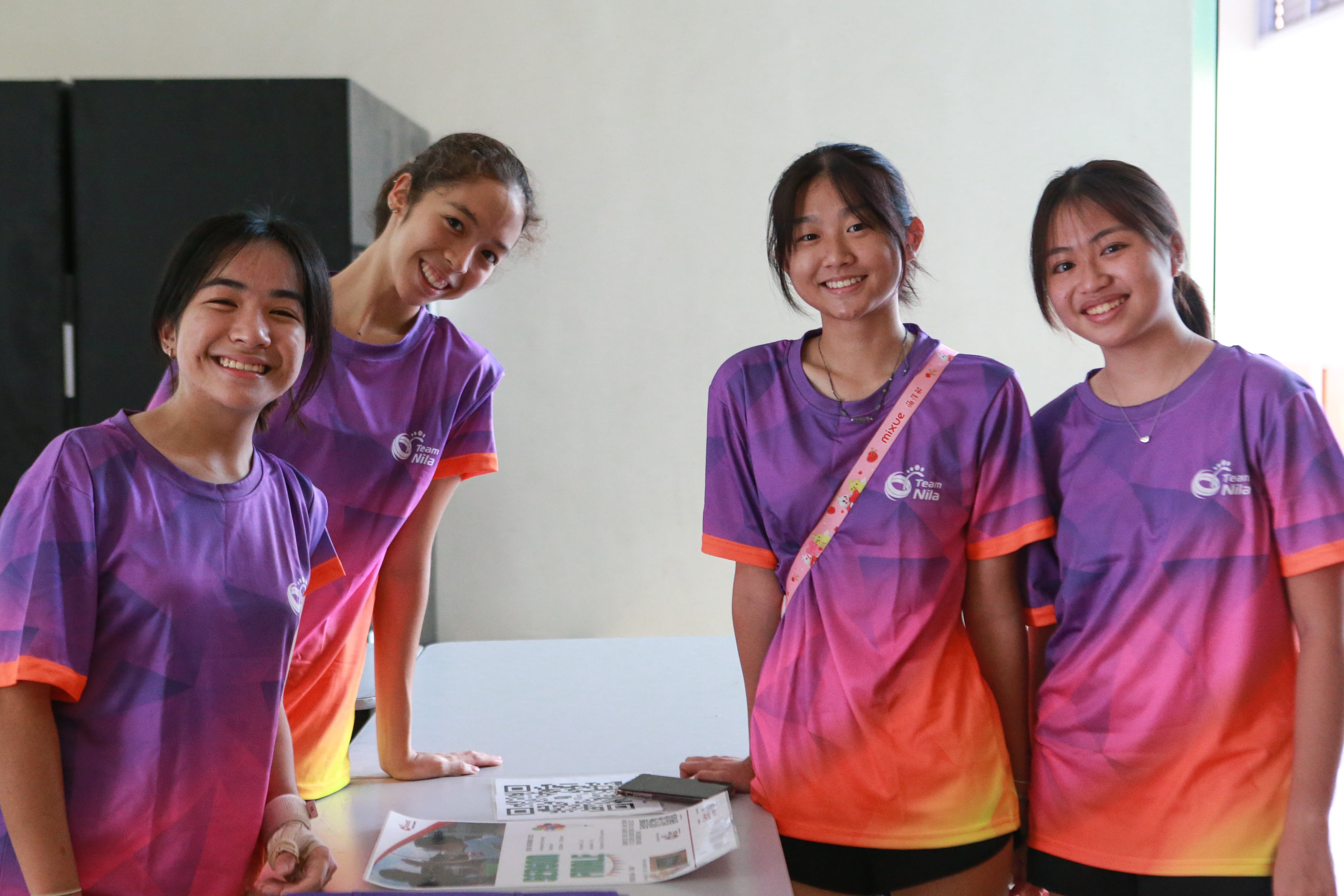 Volunteers at a sport event pose for a picture